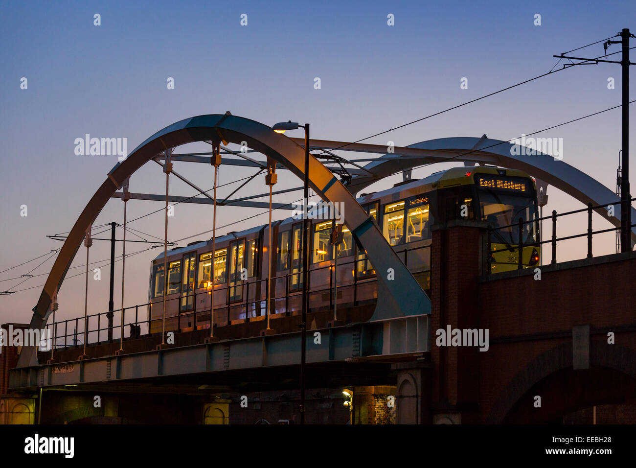 England, Manchester, Metrolink tram , at twilight Stock Photo