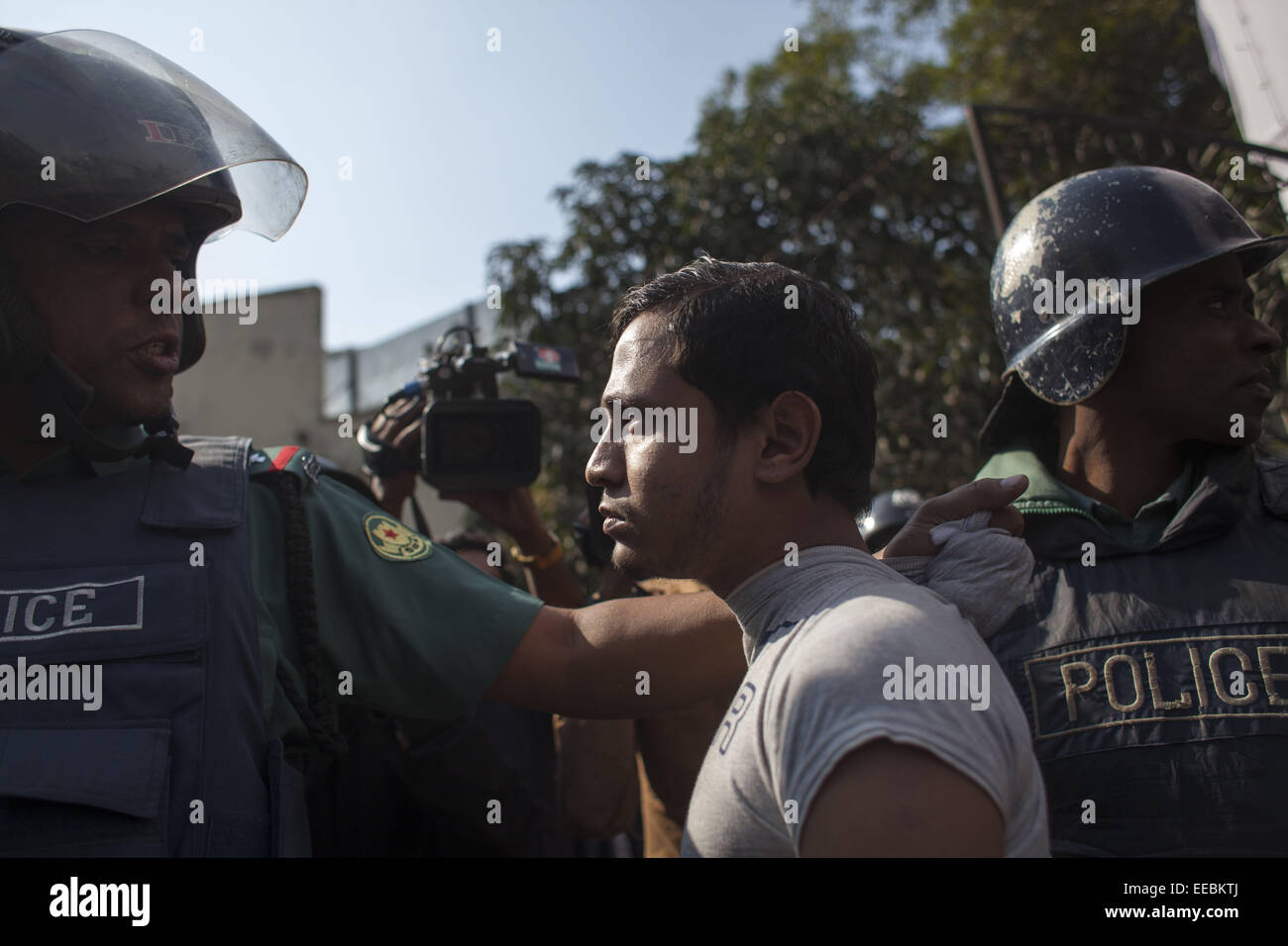 Jan. 15, 2015 - Dhaka, Bangladesh - Bangladeshi policemen detain an activist of an Islamic political group during a protest in front of Baitul mokarram mosque in Dhaka. The protest was against the Bangladeshi Prime Minister Sheikh Hasina and former Telecommunication Minister Abdul Latif Siddique after his alleged anti-Islam comments at a rally. (Credit Image: © Zakir Hossain Chowdhury/ZUMA Wire) Stock Photo