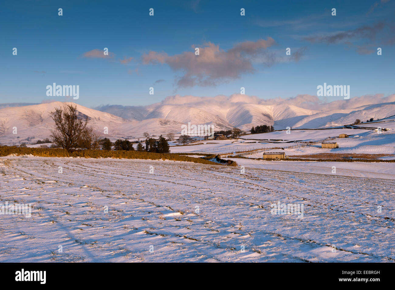 Howgill Fells in Cumbria, covered in snow on a winters evening. Stock Photo