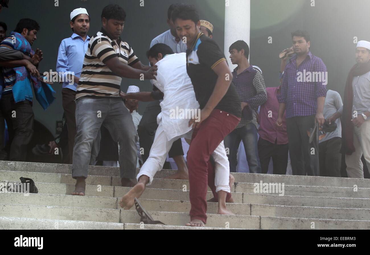 Dhaka, Bangladesh. 15th January, 2015. Bangladesh ruling Awami League party activists try to beat a protester, center, outside the Bangladesh National Mosque during a protest in Dhaka, Bangladesh, Thursday, Jan. 15, 2015. The protest was against Bangladeshi Prime Minister and leader of the Awami League party Sheikh Hasina and former telecommunication minister Abdul Latif Siddique after his alleged anti-Islam comments at a rally. Photo: Monirul Alam © Monirul Alam/ZUMA Wire/Alamy Live News Stock Photo