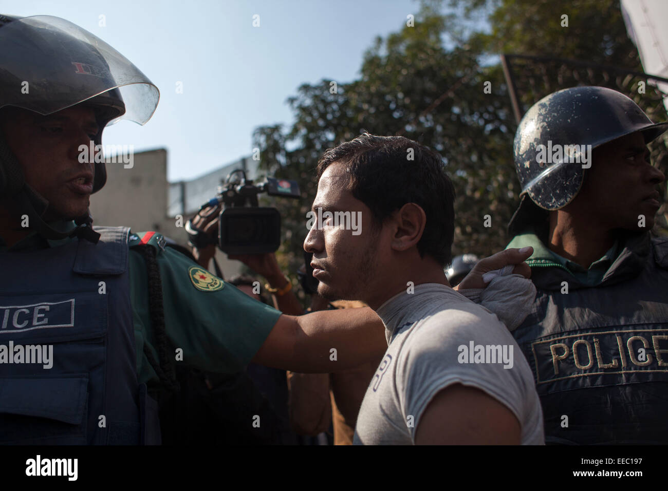 Dhaka, Bangladesh. 15th Jan, 2015. Bangladeshi policemen detain an activist of an Islamic political group during a protest in front of Baitul mokarram mosque in Dhaka. The protest was against the Bangladeshi Prime Minister Sheikh Hasina and former Telecommunication Minister Abdul Latif Siddique after his alleged anti-Islam comments at a rally. © zakir hossain chowdhury zakir/Alamy Live News Credit:  zakir hossain chowdhury zakir/Alamy Live News Stock Photo