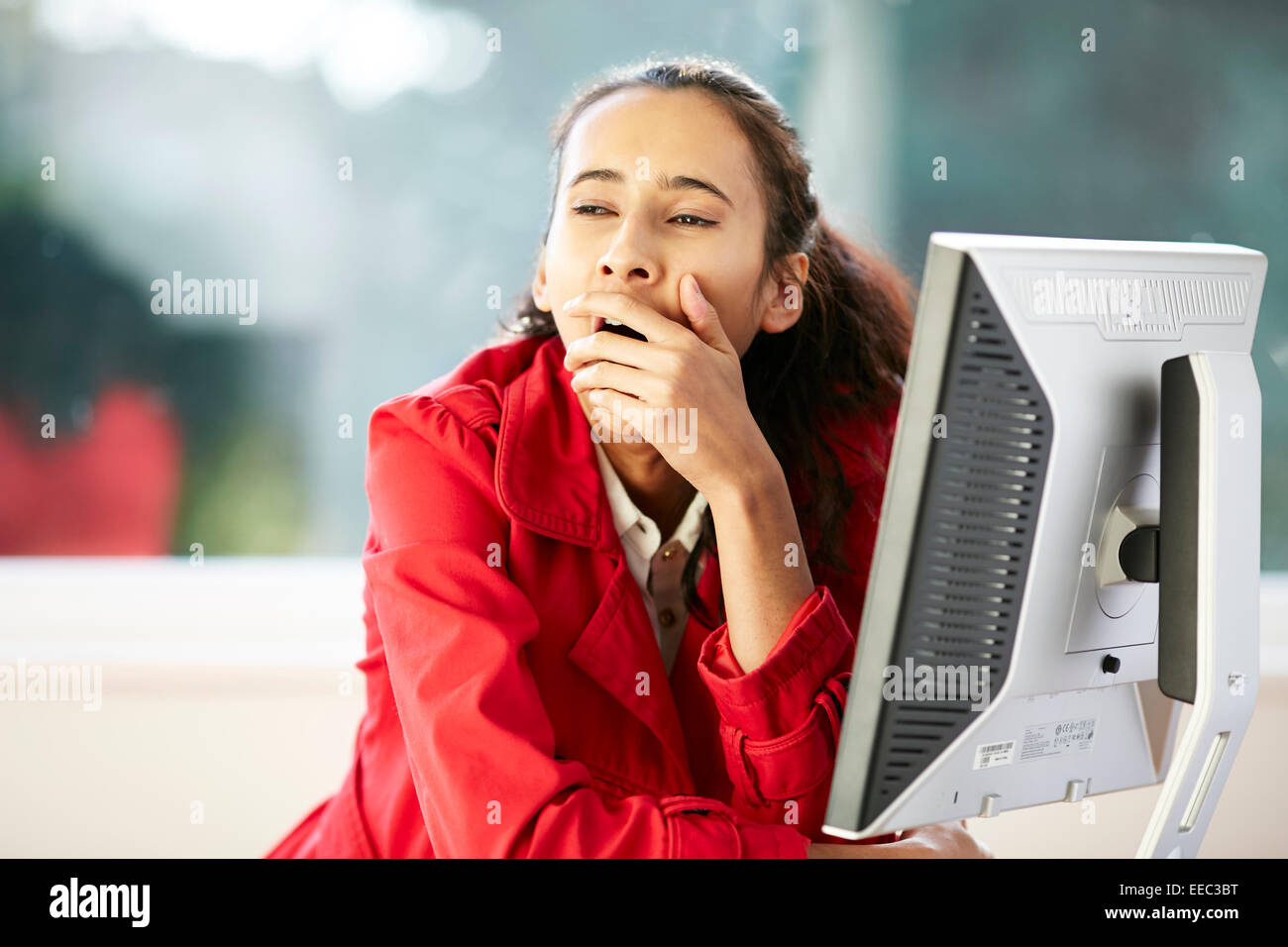 Girl bored at work Stock Photo Alamy