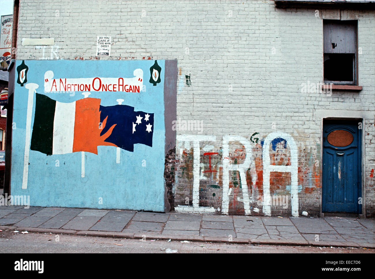 BELFAST, NORTHERN IRELAND - September 1973. United Ireland Mural and IRA Graffiti in West Belfast during The Troubles, Northern Ireland. Stock Photo