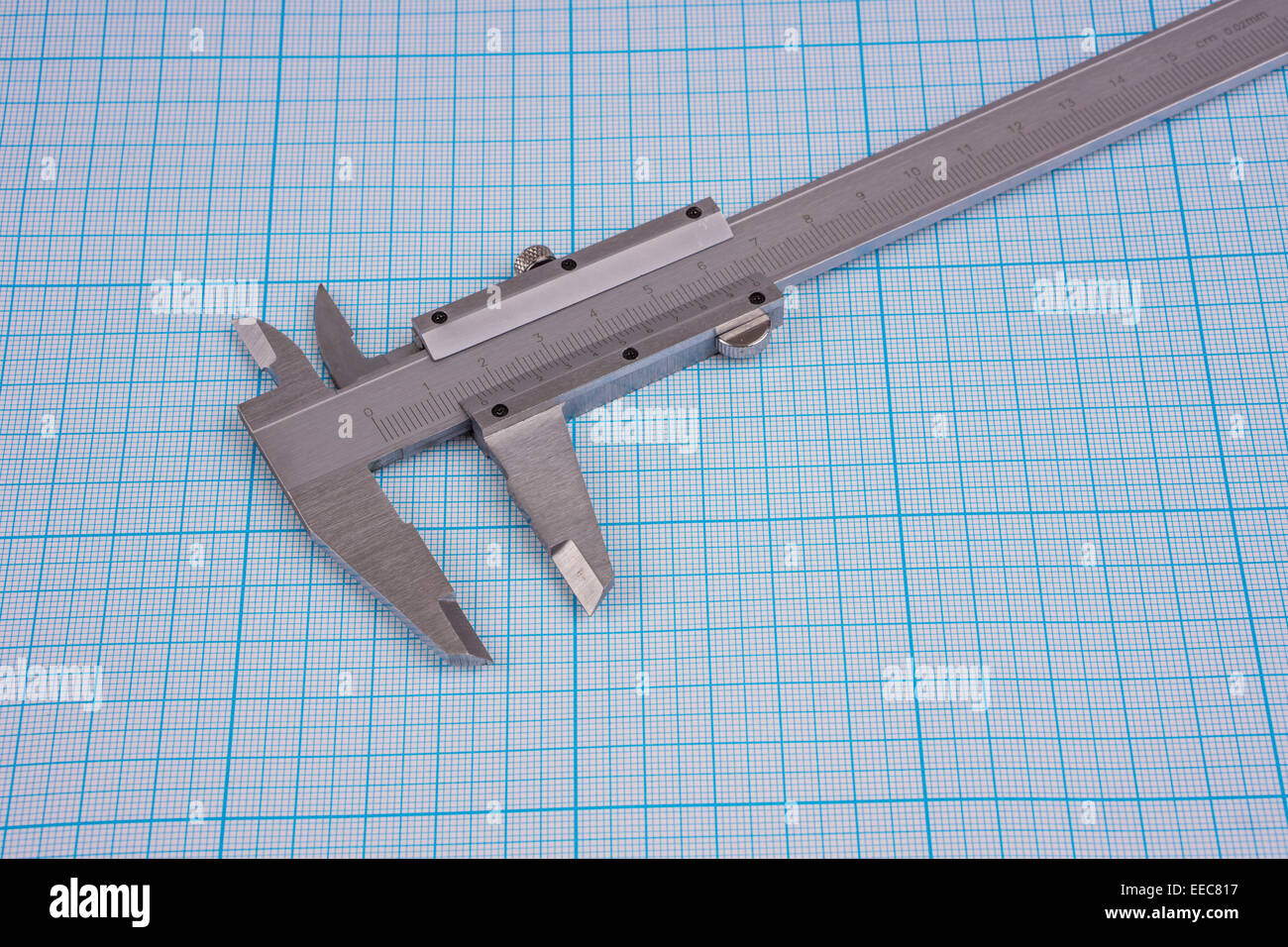 Verniercaliper on graph paper background Stock Photo Alamy