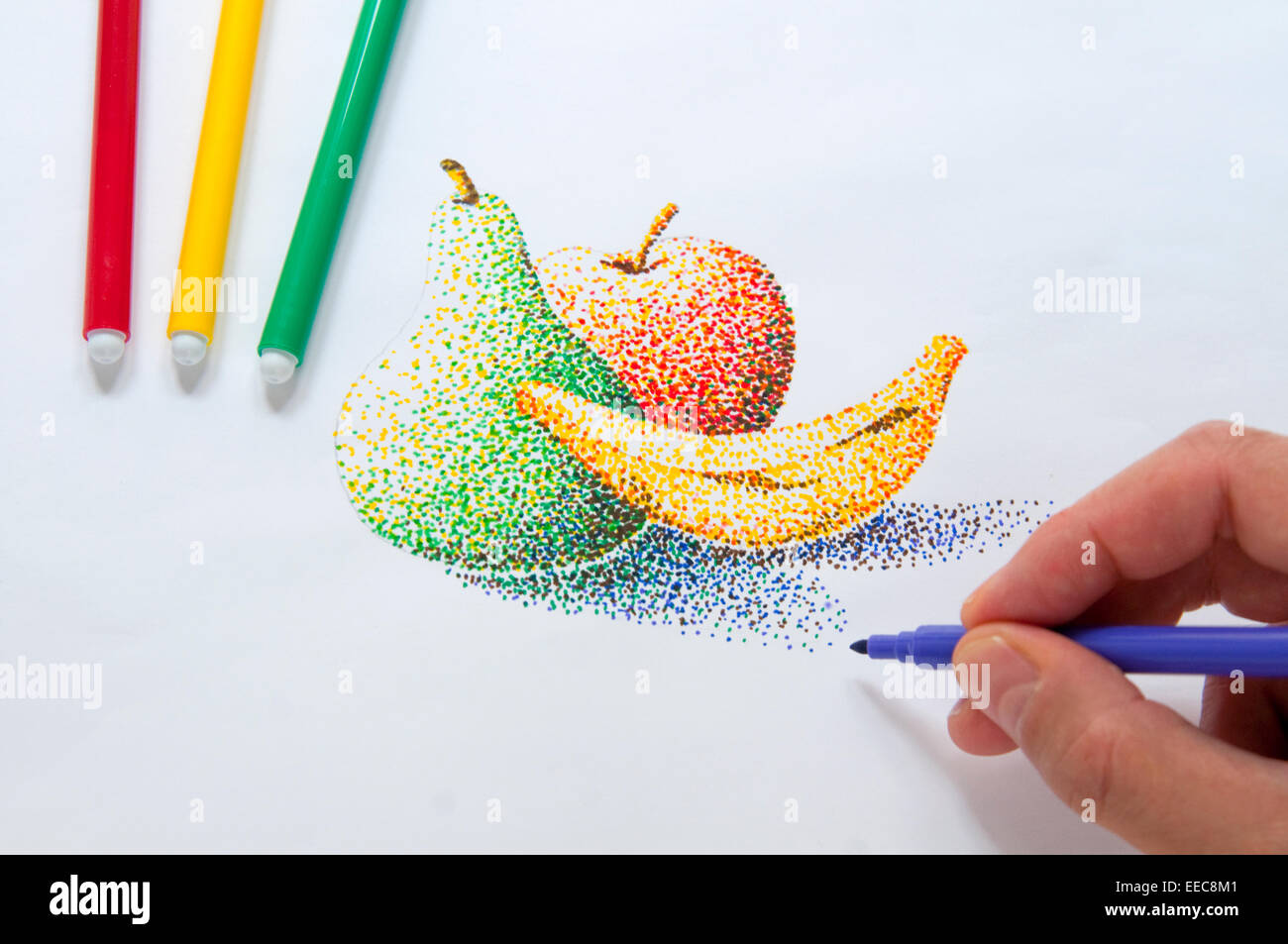 Man's hand making a pointillism drawing with color markers. Close view. Stock Photo