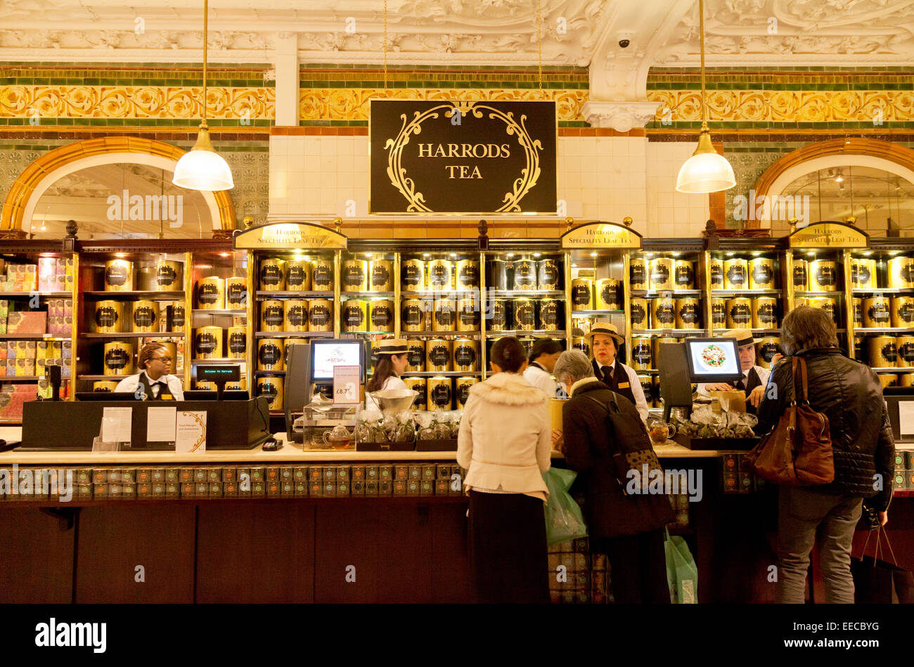 Customers at the Tea counter, the interior of Harrods Department store, Knightsbridge, London UK Stock Photo