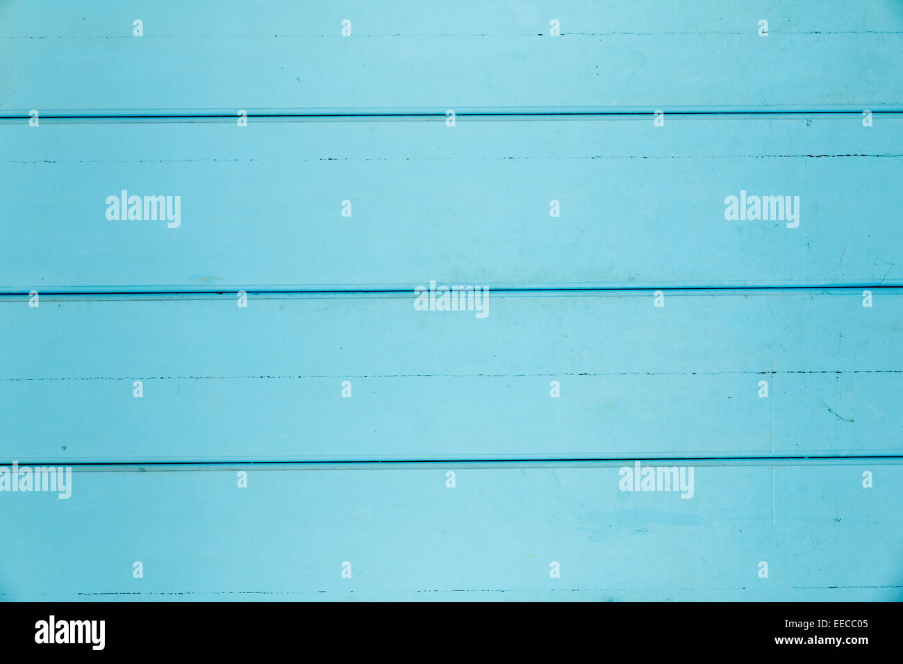 Background of turquoise wood paneling with some dings Stock Photo
