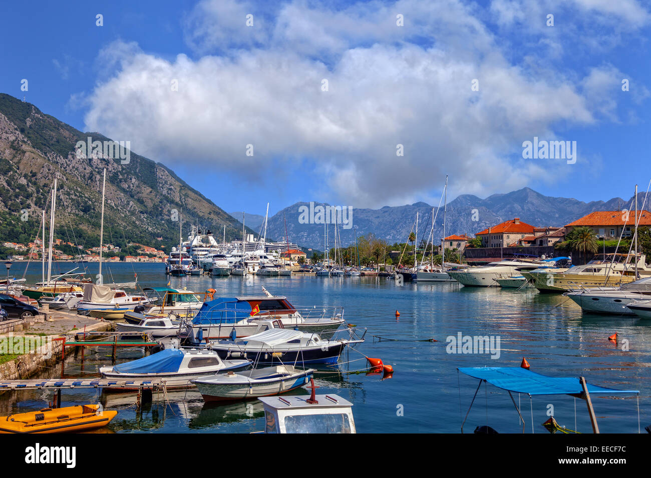 Kotor bay (Boka Kotorska) with pier and boats in Kotor, Montenegro. Stock Photo