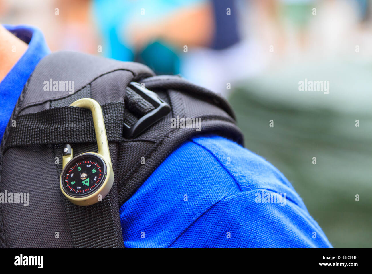 Compass attached on the bagpack of a hiker Stock Photo