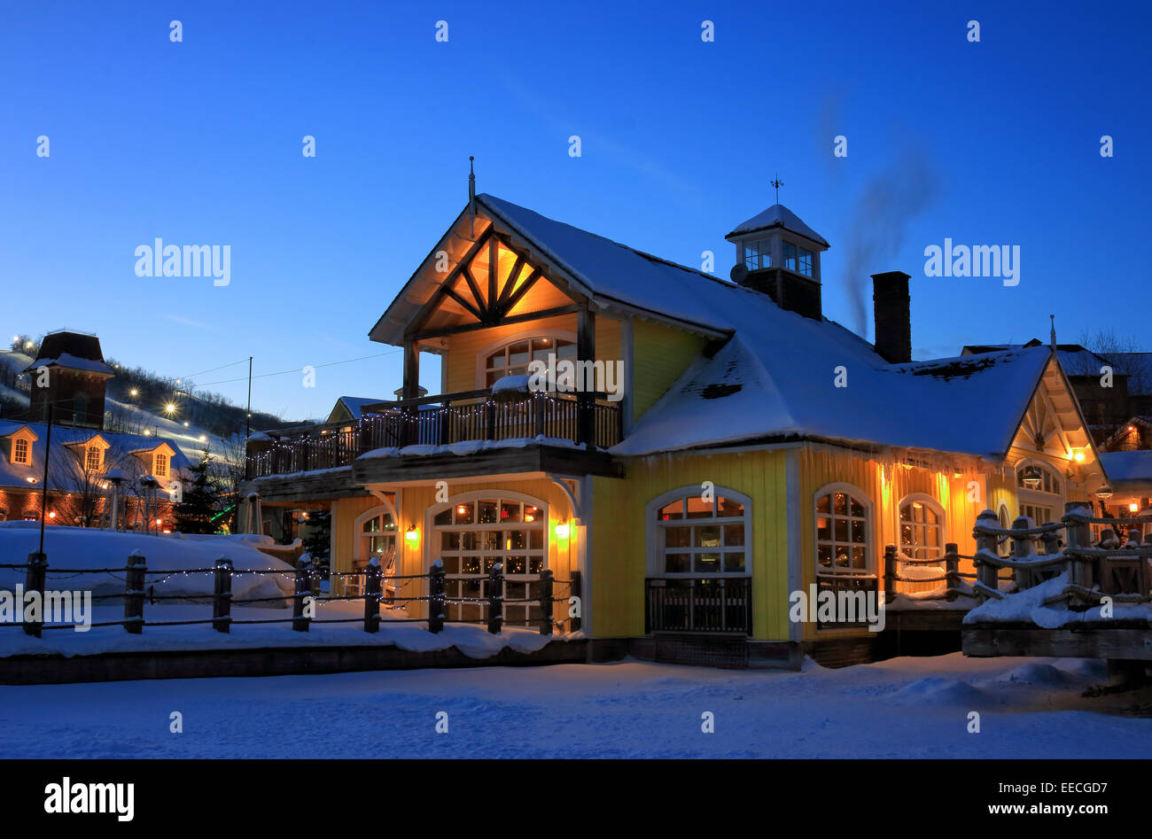 Fair tale styled Blue Mountain Village with resorts, ski slopes, and restaurants at night Stock Photo