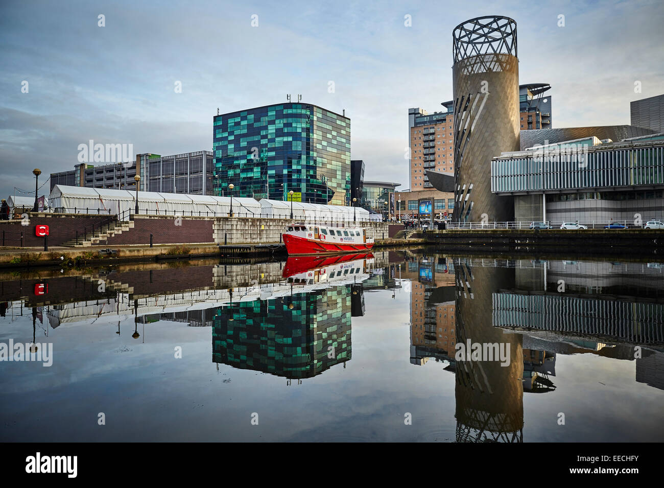 Lowry Outlet at Media City in Salford Quays, Manchester Cruises boat moored in the basin Stock