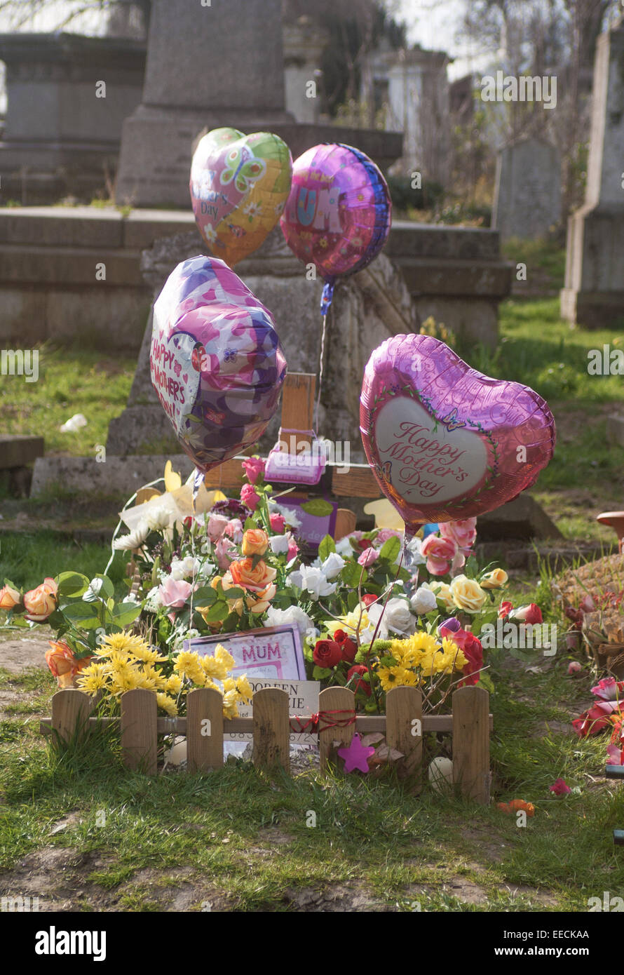 mother's grave in cemetery balloon tribute grave Stock Photo