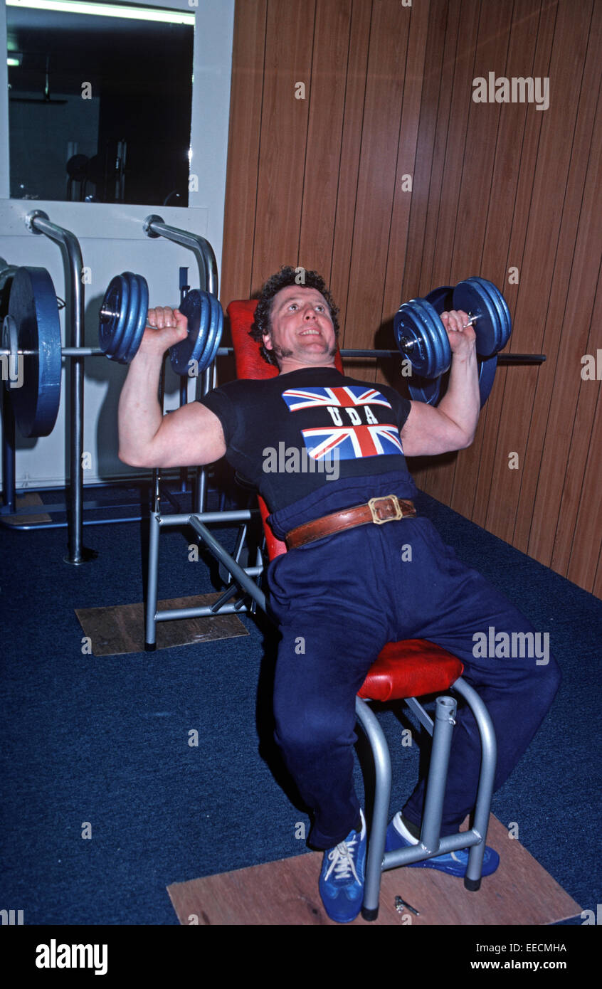 BELFAST, UNITED KINGDOM - NOVEMBER 1979. Weight training member of the Ulster Defence Association, UDA, Loyalist Protestant paramilitary during The Troubles, Northern Ireland. Stock Photo