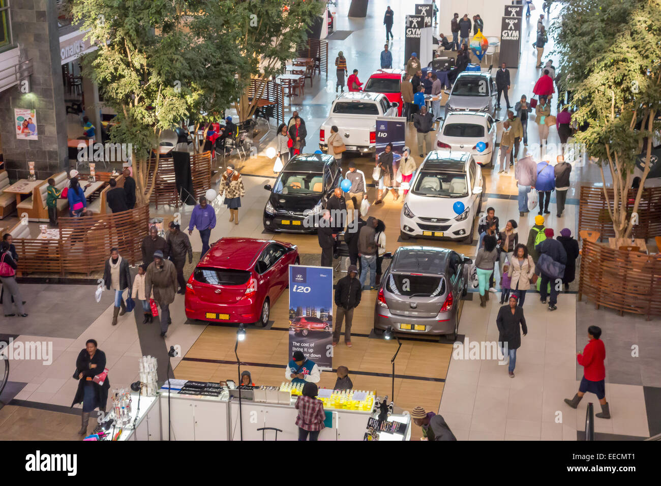 SOWETO, JOHANNESBURG, SOUTH AFRICA - New cars and shoppers at the Maponya Mall shopping center. Stock Photo