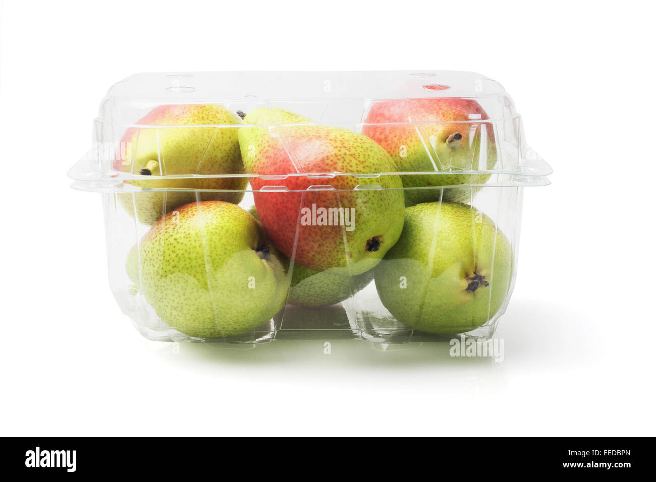 Fresh Blush Pears In Plastic Container On White Background Stock Photo