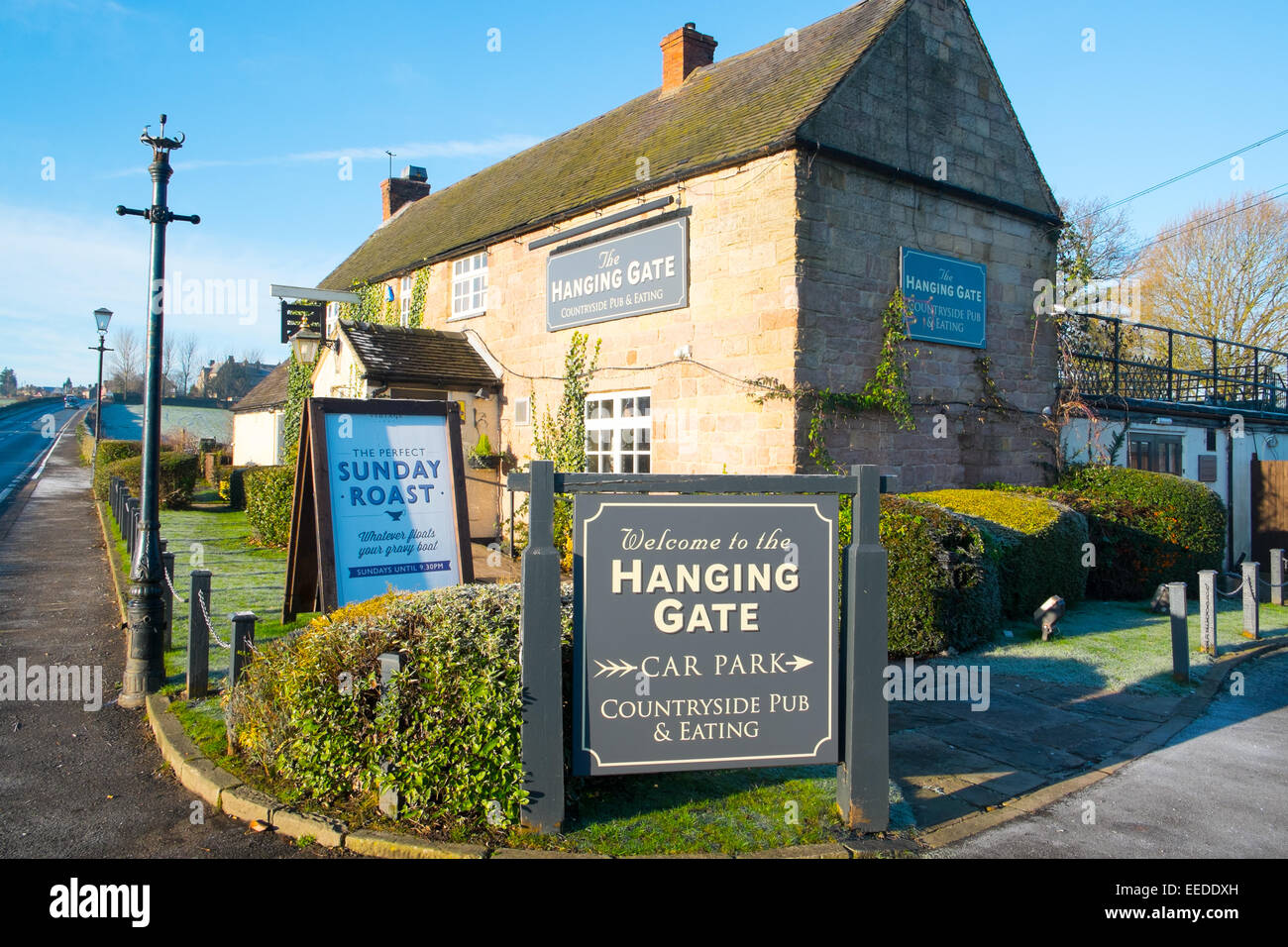 hanging gate pub and restaurant in the derbyshire dales village of Shottle, England Stock Photo