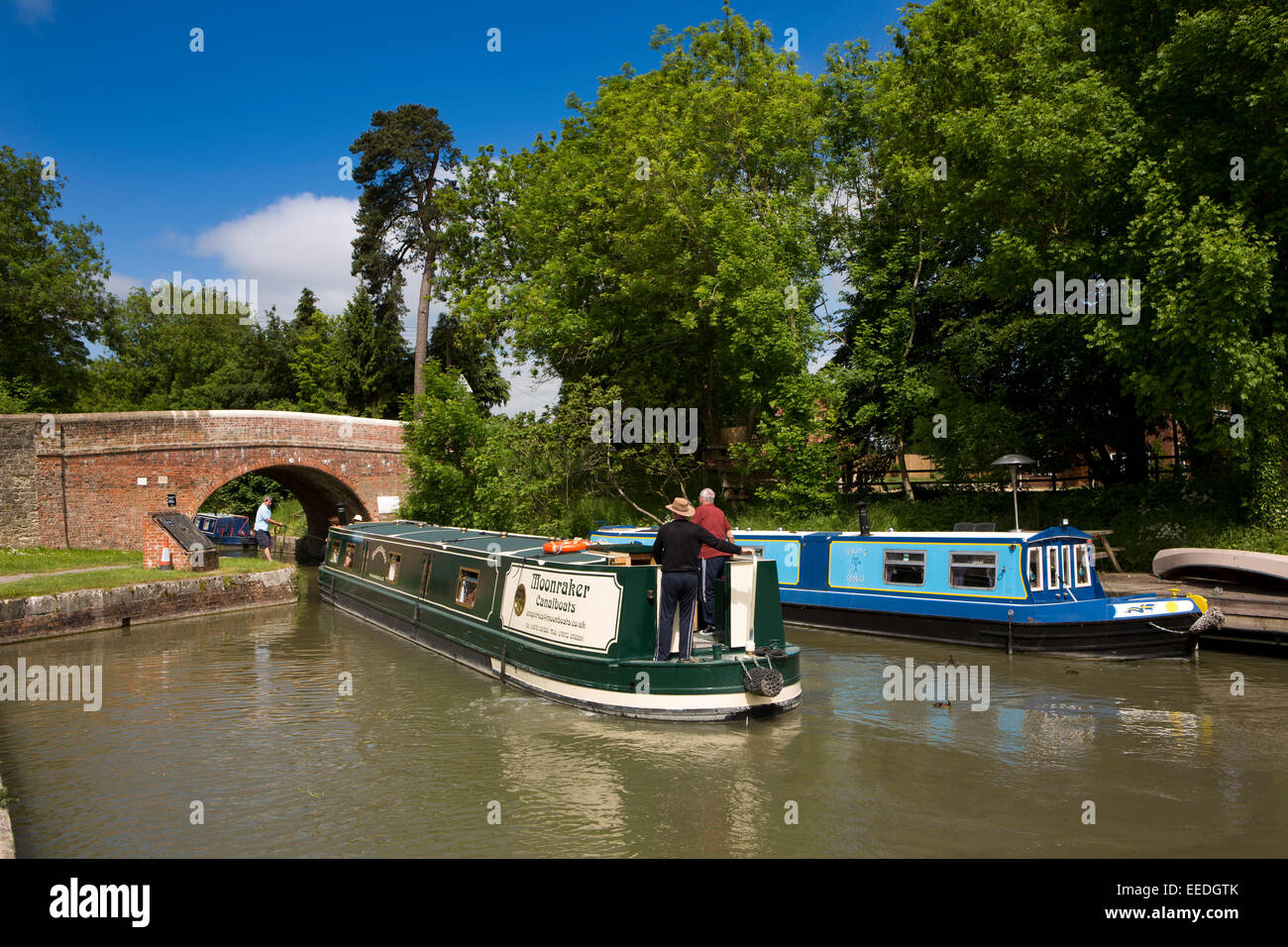 UK, England, Wiltshire, Pewsey Wharf, narrowboat passing under bridge on Kennett and Avon Canal Stock Photo