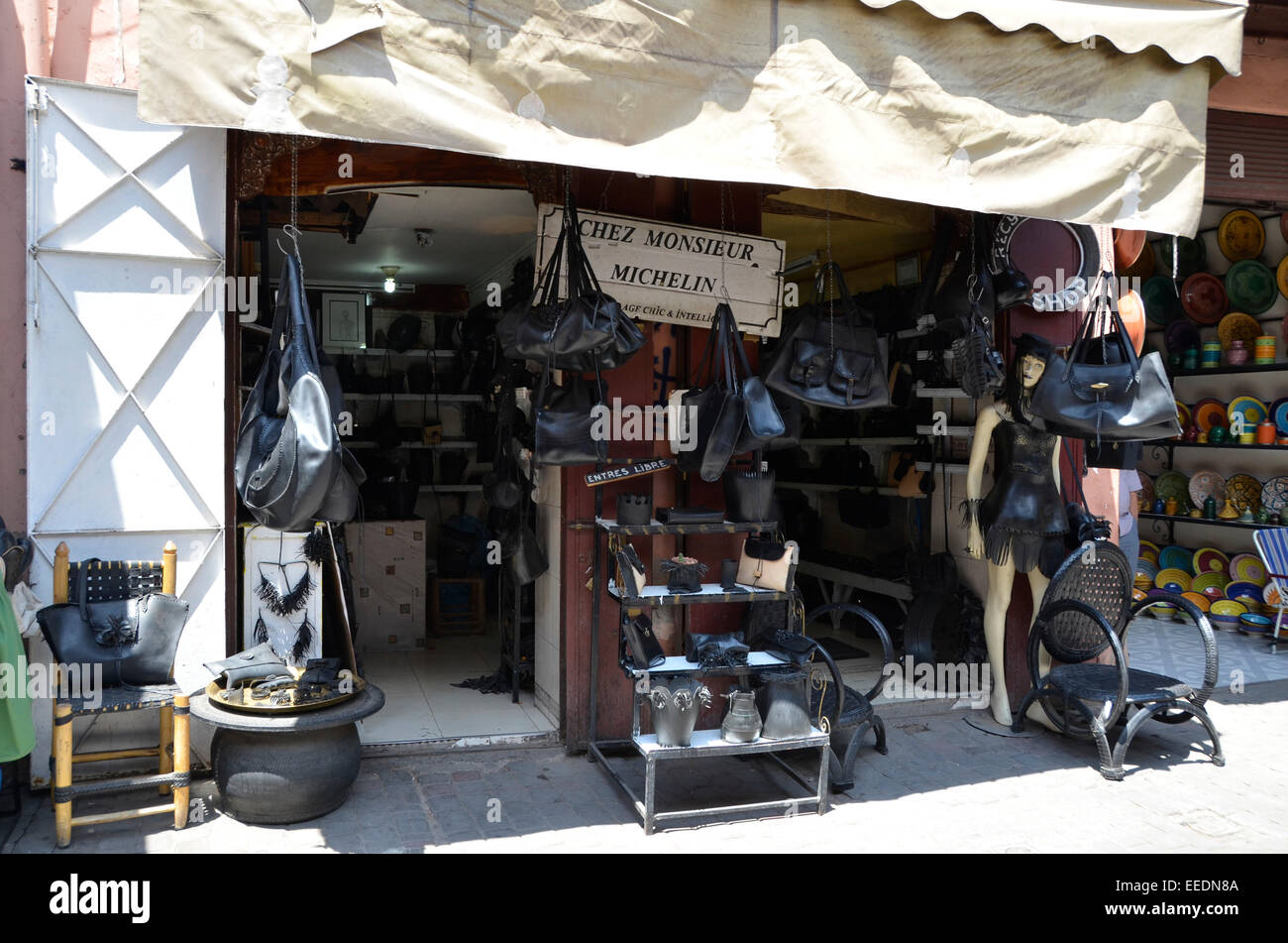 Shop in the Marrakech Marrakesh market souk selling goods of recycled rubber tires Stock Photo