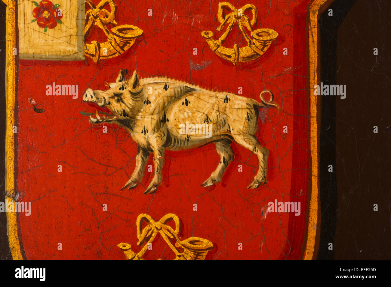 Family crest painted shield with a wild boar image and hunting horns