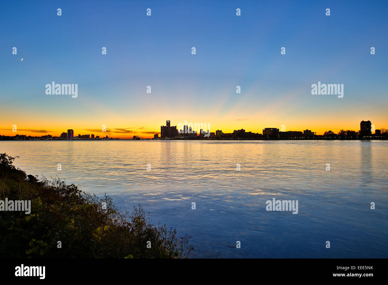 Sundown over Downtown Detroit, Ambassador Bridge and Windsor ( Canada ), Michigan, USA. Oct. 26, 2014. Stock Photo