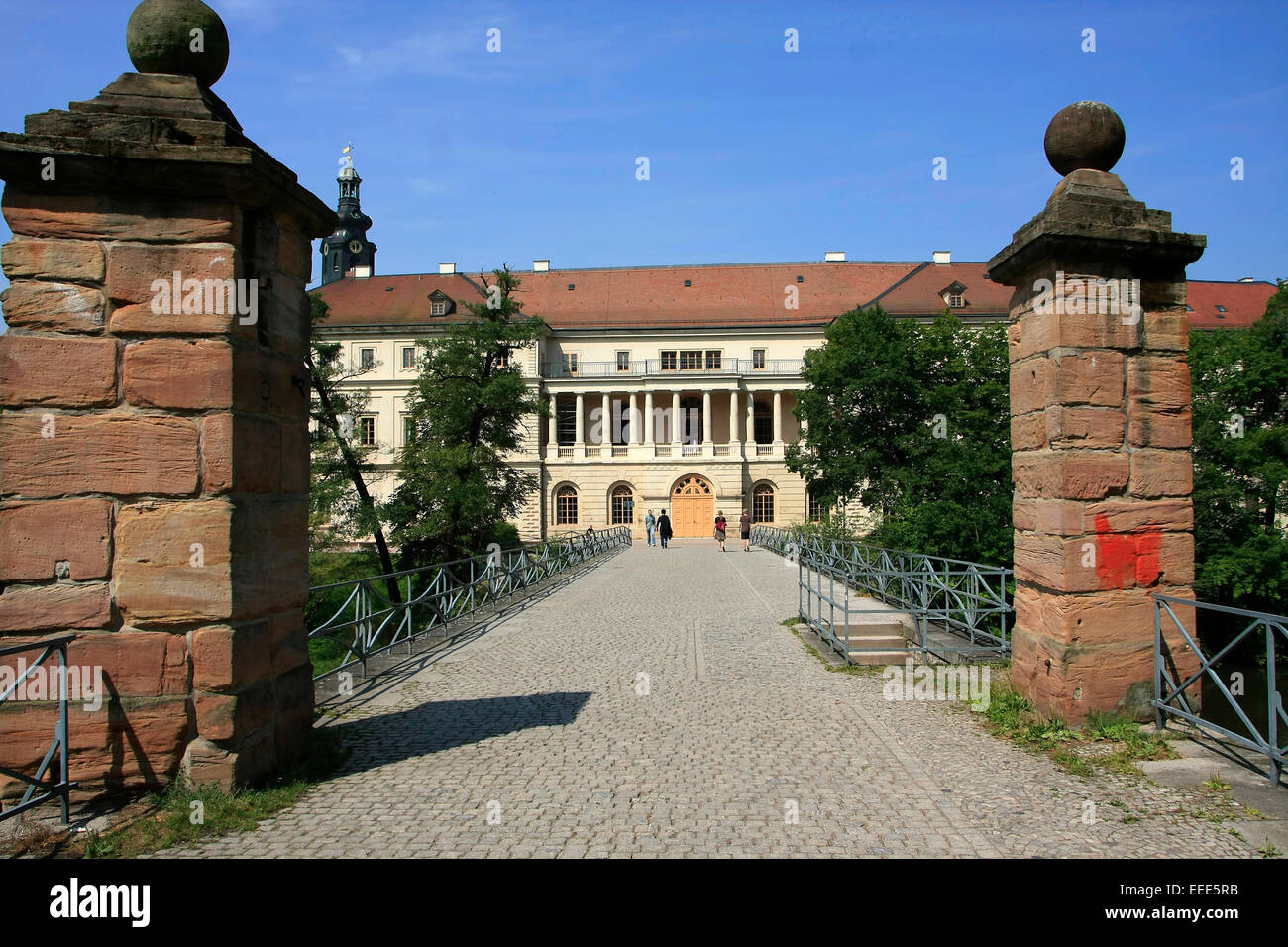 The star bridge in Weimar. The star bridge (Sternenbruecke) was built in 1654 and the city palace built 1789 on the river Ilm. In the museum castle there is an art collection of the Weimar dukes. Photo: July 26, 2014 Stock Photo