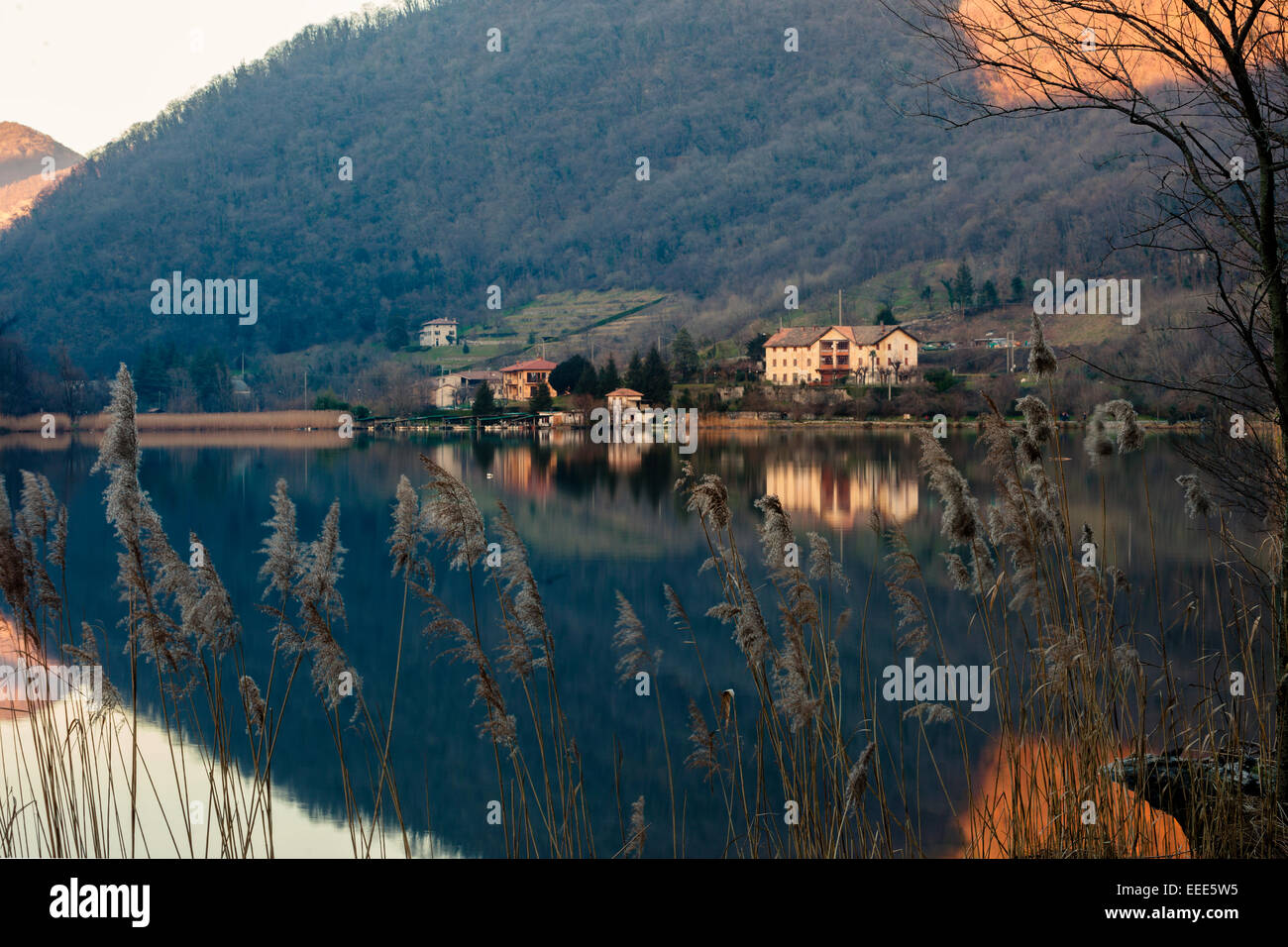 Waterscape reflection taken during sunset. The whole image seems a spearhead. Lombardia. Italy Stock Photo