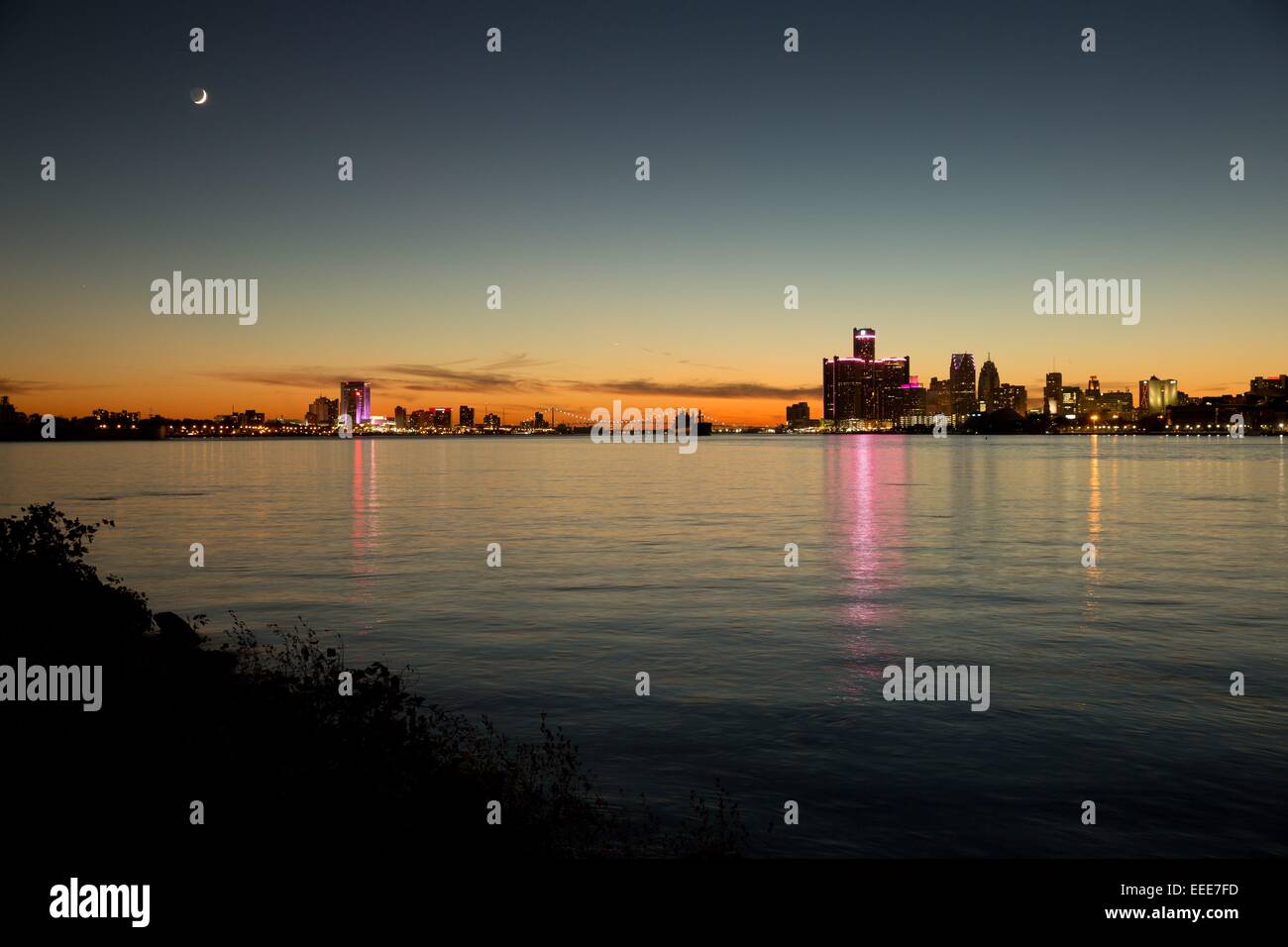 Sundown over Downtown Detroit, Ambassador Bridge and Windsor ( Canada ), Michigan, USA. Oct. 26, 2014. Stock Photo