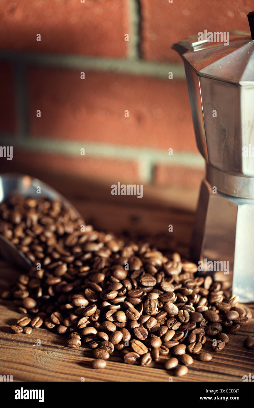 the coffee beans on wooden table Stock Photo - Alamy