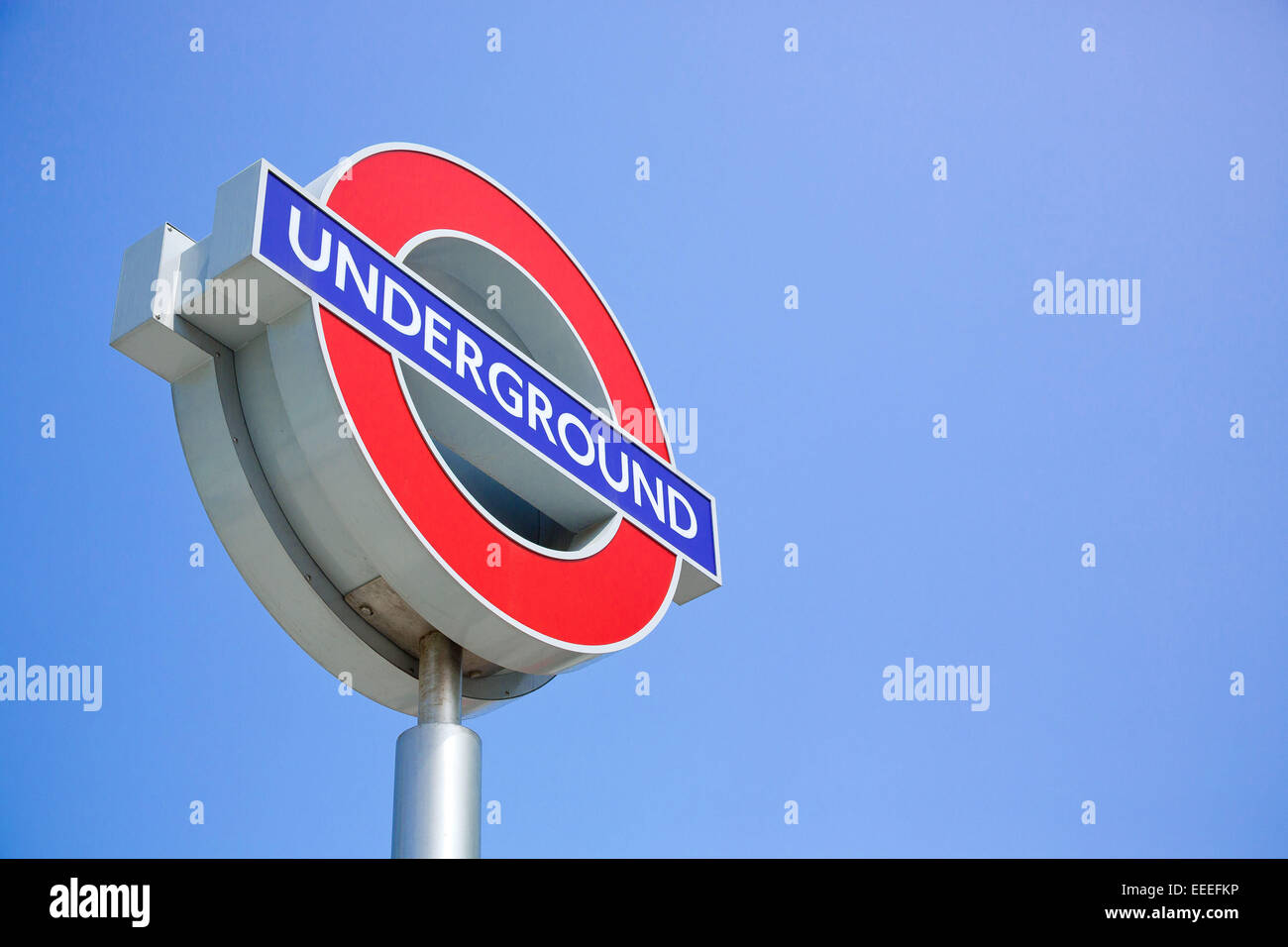 London Underground logo sign against a blue sky Stock Photo