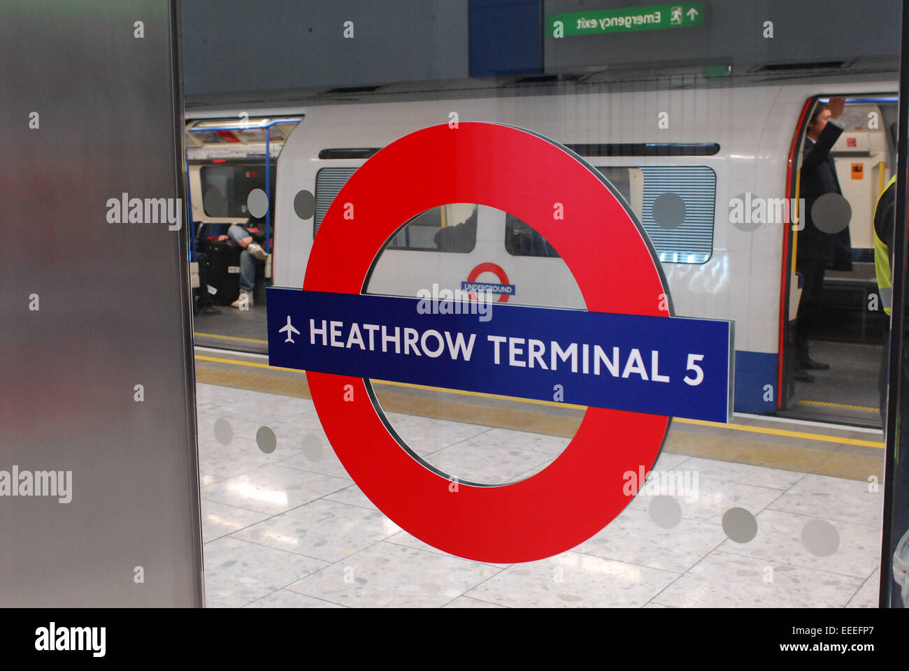 Station roundel at Heathrow Terminal 5 Underground station Stock Photo