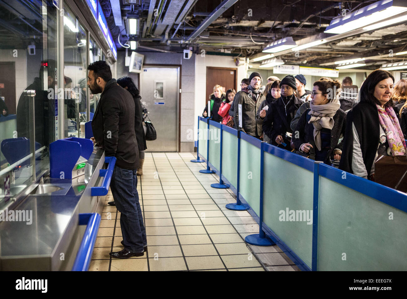 Getting assistance at a London Underground ticket office Stock Photo