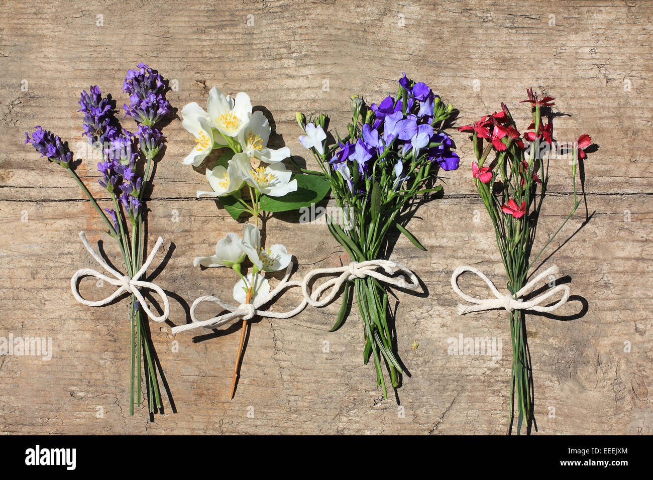 Various flowers on the wooden, rustic table Stock Photo