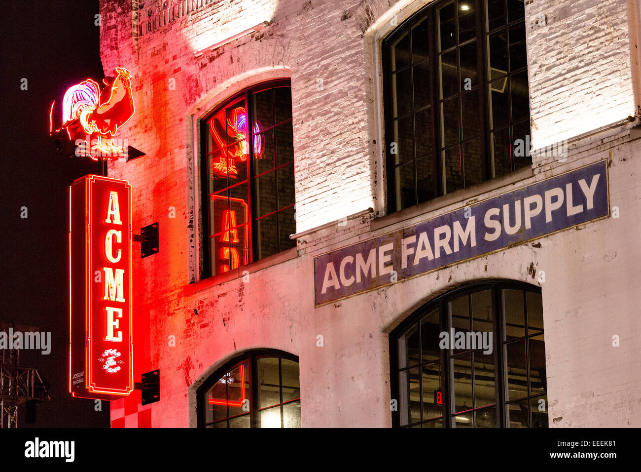 Neon sign for Acme Farm Supply restaurant on lower Broadway in Nashville, TN. Stock Photo