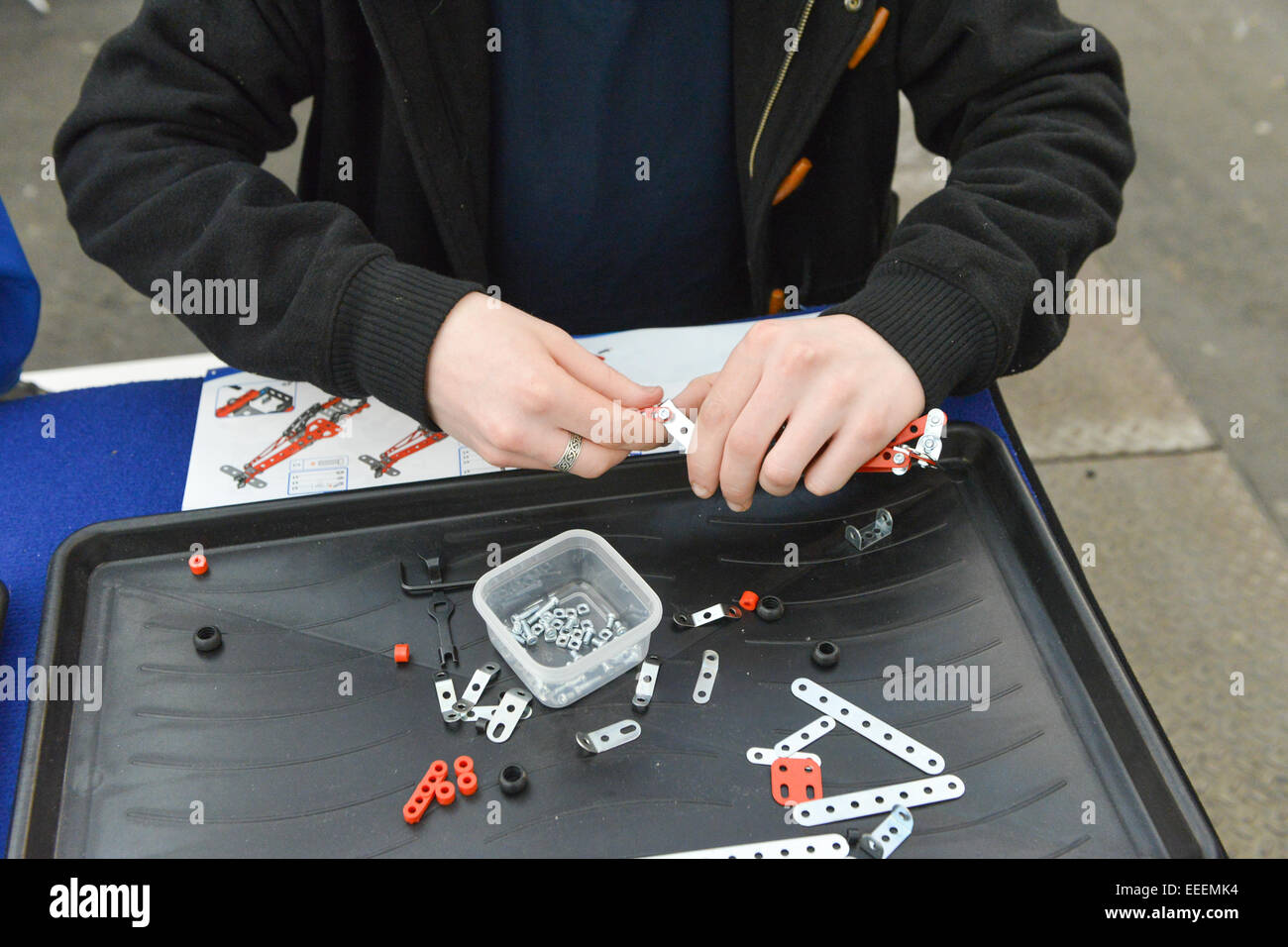 Alexandra Palace, London, UK. 16th January 2015. Making Meccano models, of the many types of models on display. The  London Model Engineering Exhibition is at Alexandra Palace over the weekend. Credit:  Matthew Chattle/Alamy Live News Stock Photo