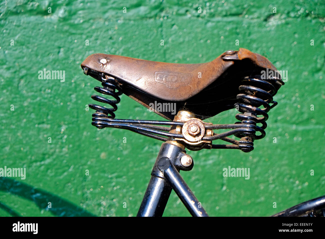 Vintage Bicycle Saddle , green wall Stock Photo