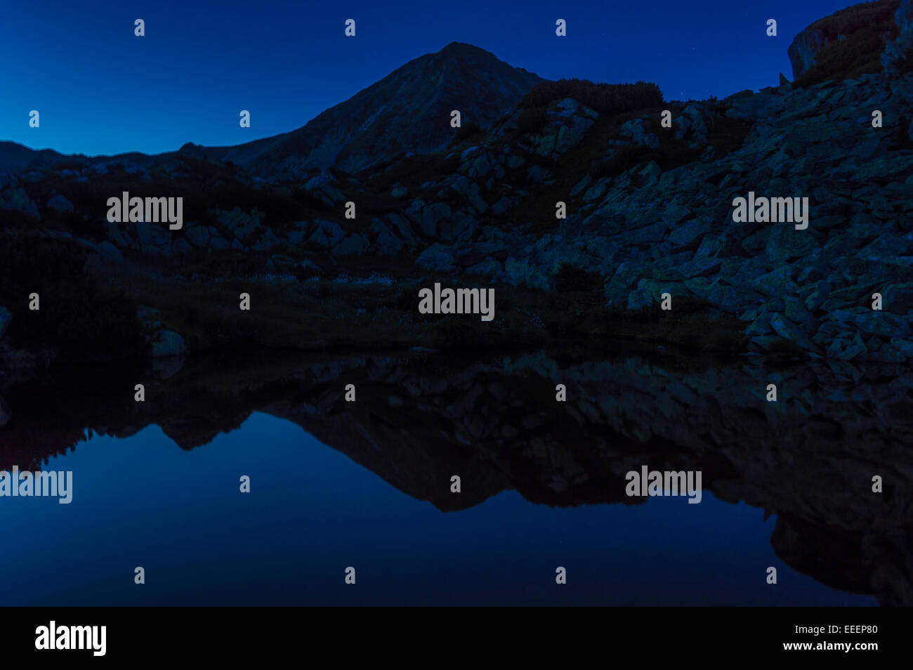 sunset over lake mountain Stock Photo - Alamy