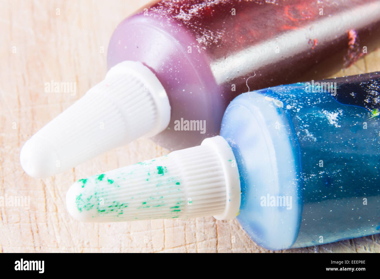 Red and Blue dirty tubes. Food colors Stock Photo