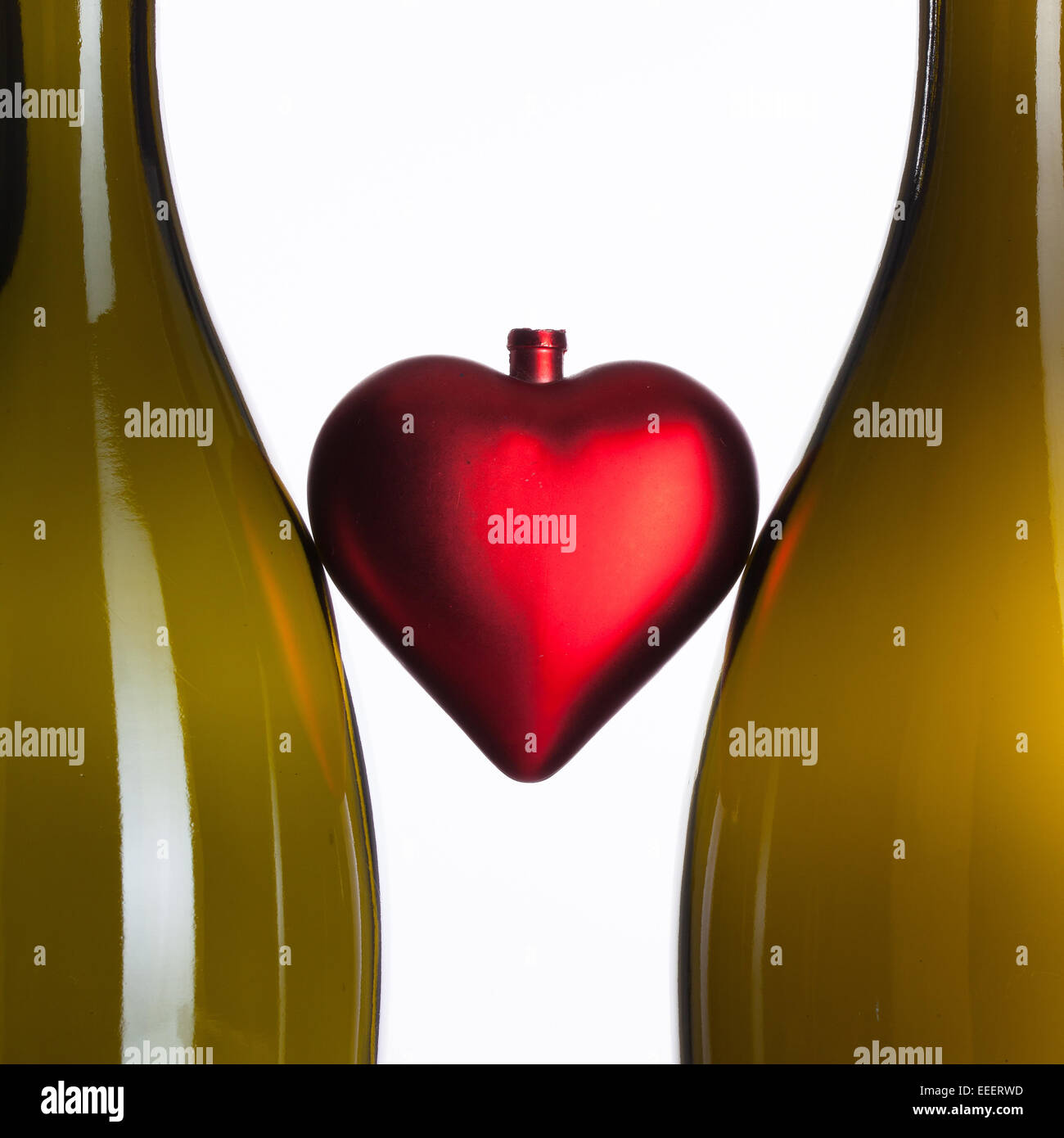 Empty bottles of wine and red heart Stock Photo