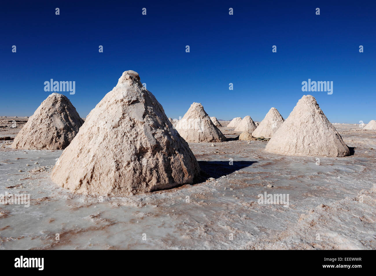 Mounds of harvested salt from the Salar de Uyuni in Bolivia. Stock Photo