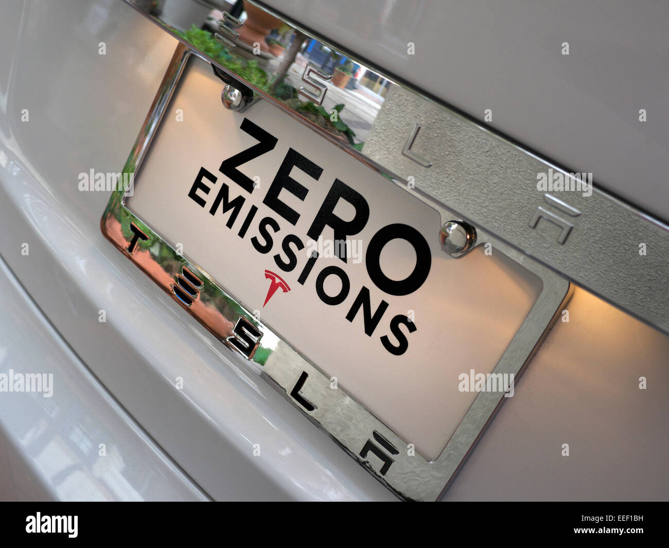Zero emissions display plate on latest Tesla Model S an all electric powered stylish sports car with 300 miles range per charge Stock Photo