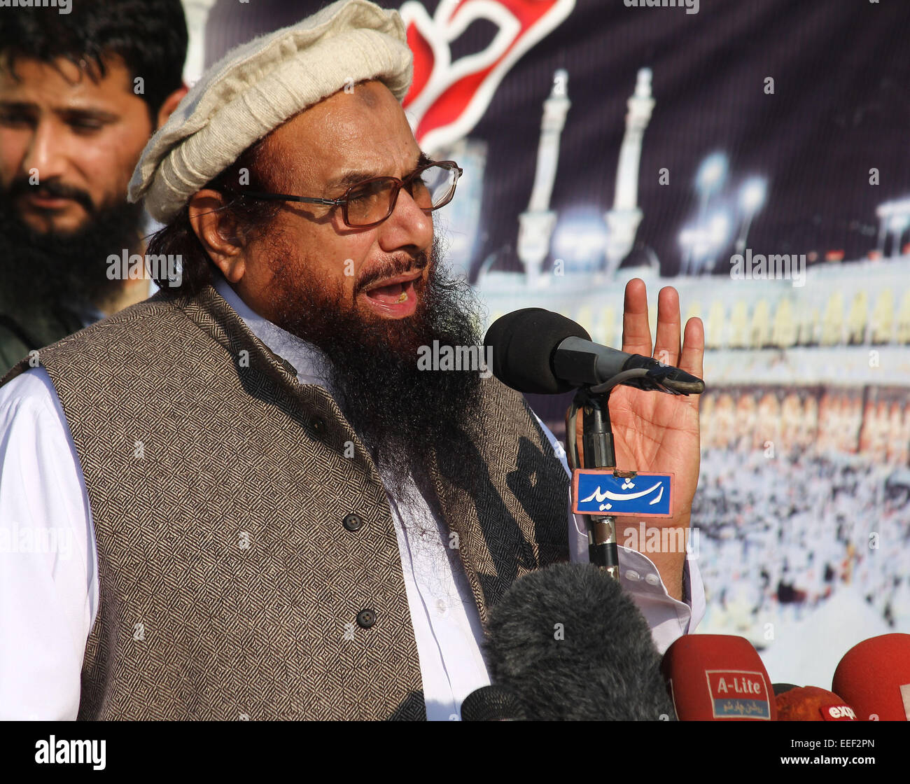 Lahore, Pakistan. 16th Jan, 2015. . 16th Jan, 2015. Ameer Jamaat-ud-Dawa Hafiz Muhammad Saeed addressing the demonstrators during a protest against condemning the blasphemous caricatures of Prophet Mohammad published by French satirical magazine, Charlie Hebdo, which turned to some clashes between policemen and the protesters. © Rana Sajid Hussain/Pacific Press/Alamy Live News Credit:  PACIFIC PRESS/Alamy Live News Stock Photo