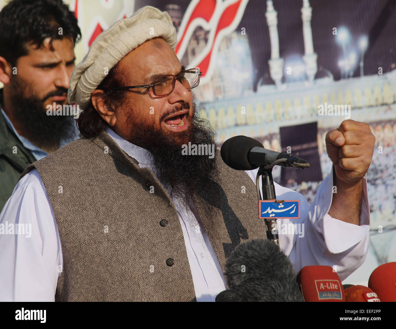 Lahore, Pakistan. 16th Jan, 2015. . 16th Jan, 2015. Ameer Jamaat-ud-Dawa Hafiz Muhammad Saeed addressing the demonstrators during a protest against condemning the blasphemous caricatures of Prophet Mohammad published by French satirical magazine, Charlie Hebdo, which turned to some clashes between policemen and the protesters. © Rana Sajid Hussain/Pacific Press/Alamy Live News Credit:  PACIFIC PRESS/Alamy Live News Stock Photo