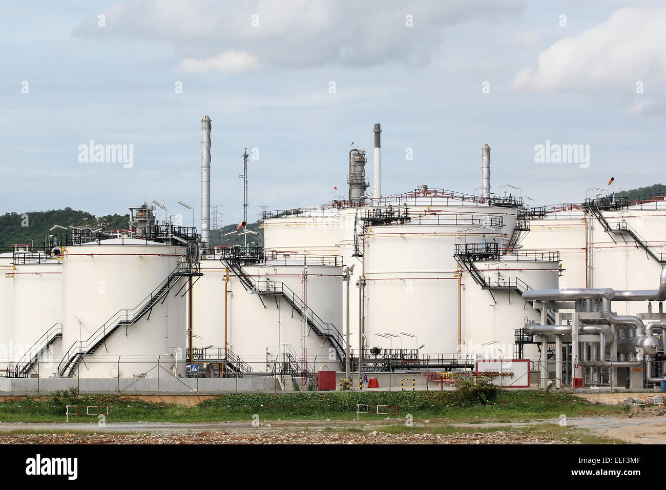 Storage oil tanks in Oil refinery Stock Photo - Alamy