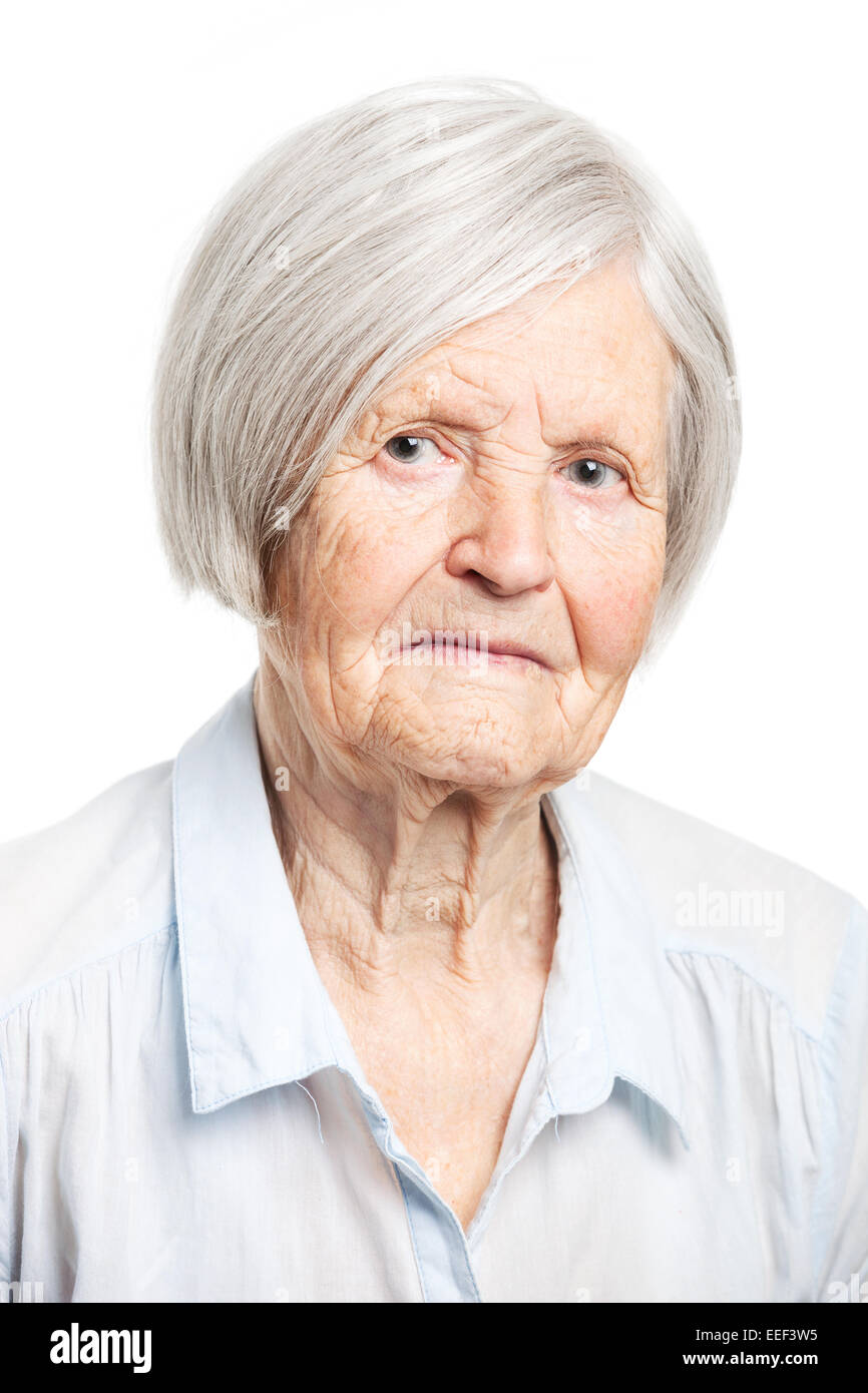 Portrait of a senior woman looking at the camera. Over white background ...