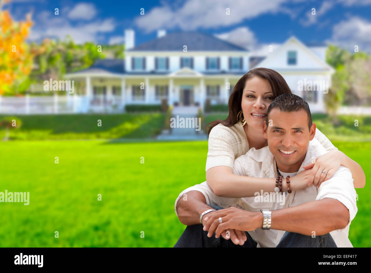Young Happy Hispanic Young Couple in Front of Their New Home Stock ...
