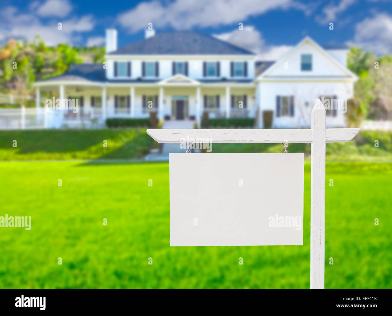 Blank Real Estate Sign in Front of Beautiful New House Stock Photo - Alamy