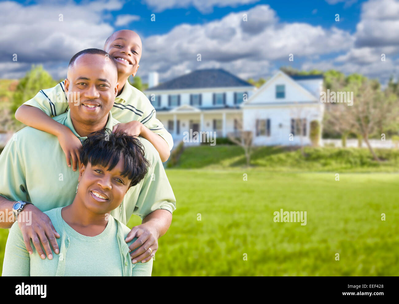 Family in front of their house hi-res stock photography and images - Alamy