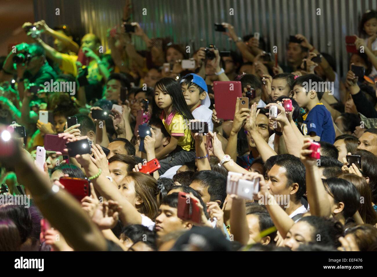Manila, Philippines. 16th Jan, 2015. The crowd waits for Pope Francis arrival for his mass at the Manila Cathedral on his second day of visit in the country. Credit:  Mark Cristino/Pacific Press/Alamy Live News Stock Photo