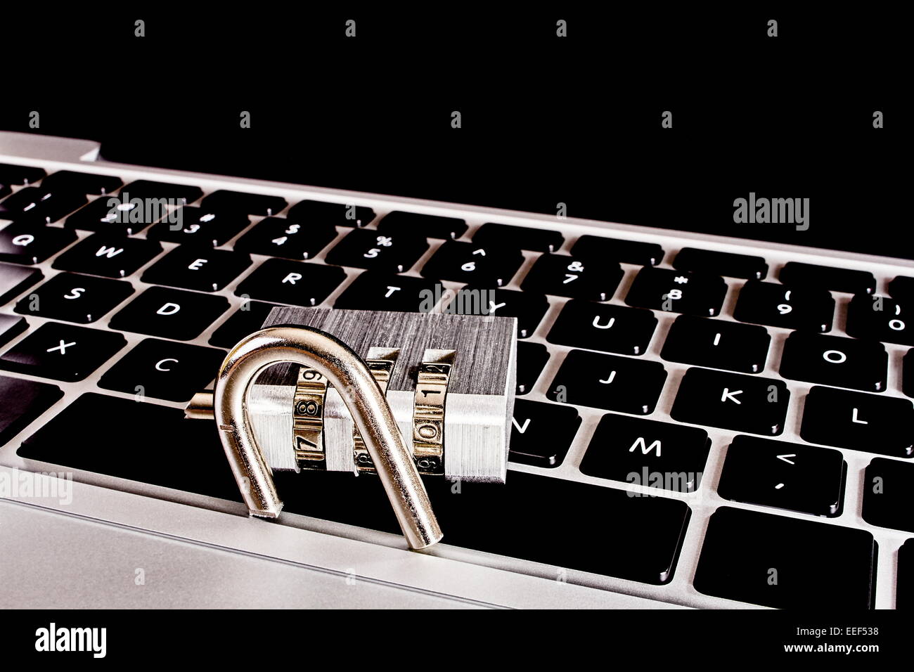 Laptop computer with broken combination lock Stock Photo