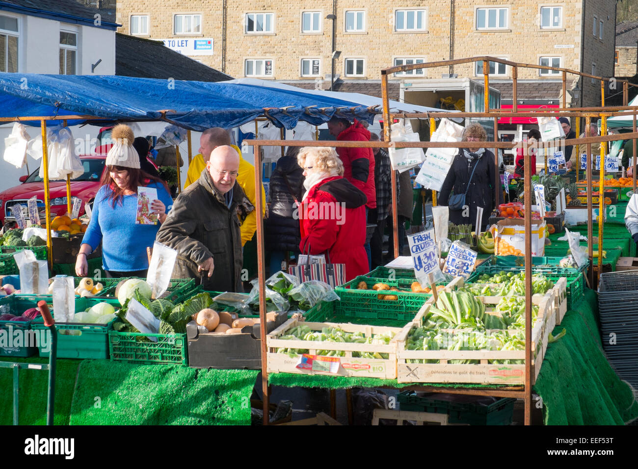 Shoppers at the outdoor grocery vegetable market in the lancashire